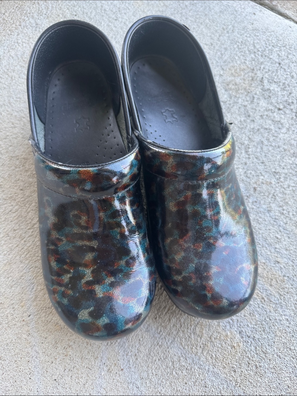 Dansko Glossy Multicolor Leopard-Print Clogs in Black, Teal, Brown